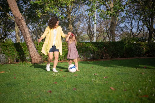 family playing soccer together