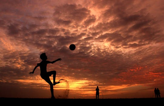 happy child playing soccer