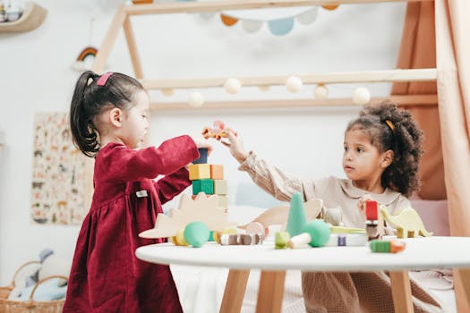 happy child playing with colorful toys